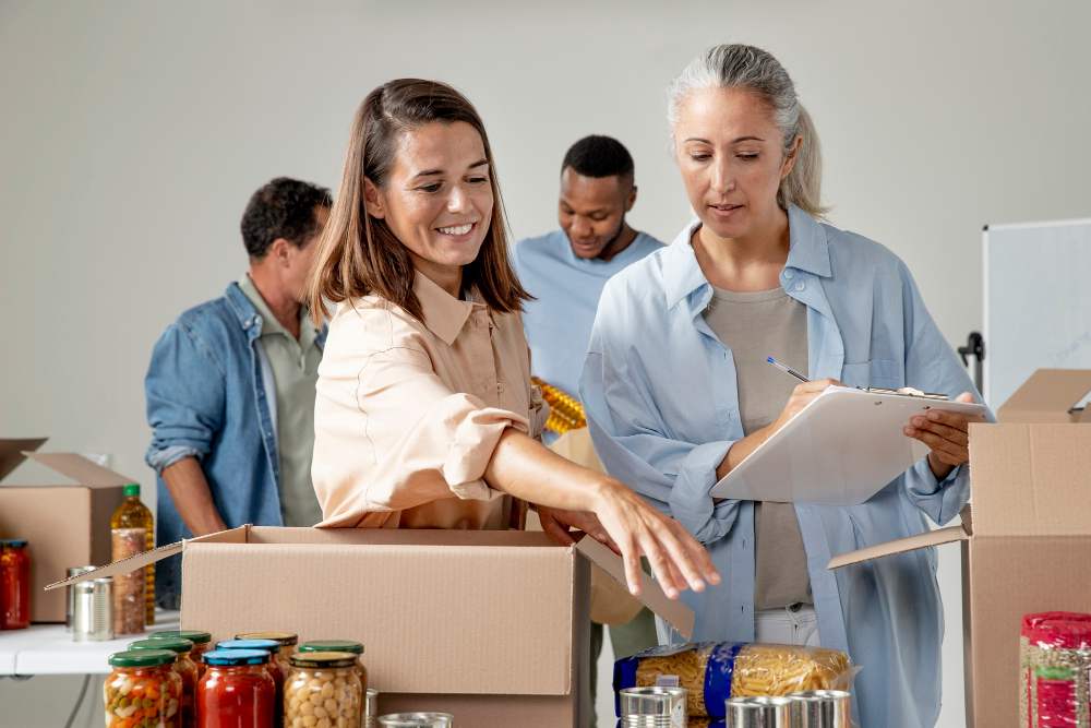 medium-shot-volunteers-with-food-donations